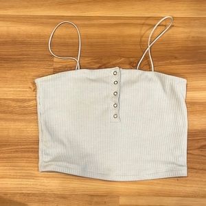 Tank top, light blue color, you can undo the buttons